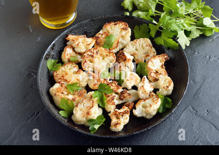 Vegetarian food. Fried cauliflower in frying pan, close up view Stock Photo