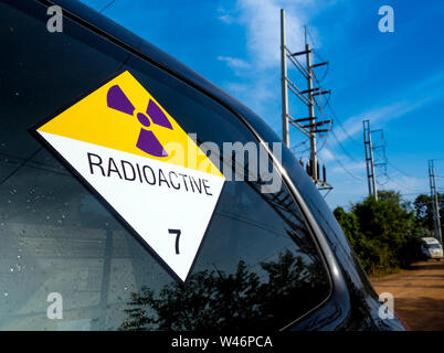 Radiation warning sign on the Hazardous materials transport label Class 7 at the transport truck Stock Photo