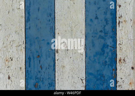 Wooden painted shelves three white shelves two blue shelves the paint peels off it Stock Photo