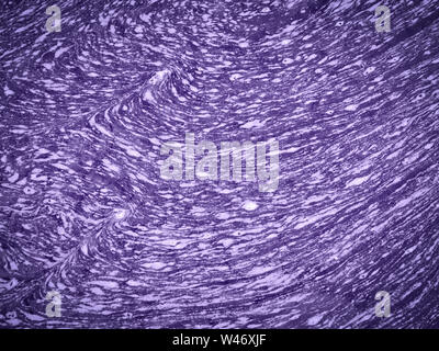 Swirls on flowing water coloured purple / violet Stock Photo