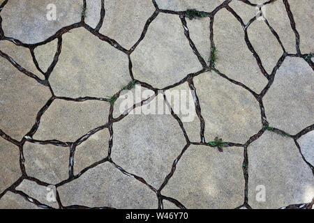 rustic cracked concrete block pavement background Stock Photo
