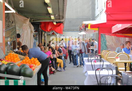 People visit Marche des Enfants Rouges market Paris France Stock Photo