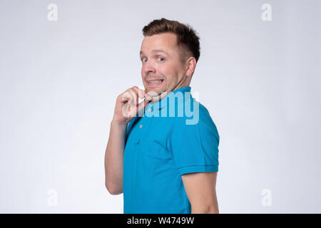 Young man in blue t-shirt with a double chin. Stock Photo