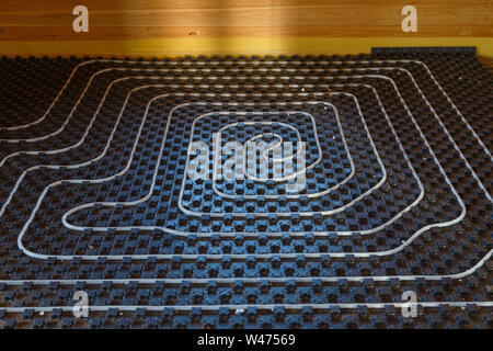Underfloor heating pipes. Low temperature heating concept. Stock Photo