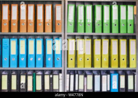 Blurred office document folders standing in a row of on document storage for background Stock Photo