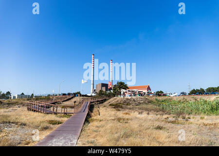 July 15th, 2019, Sao Torpes, Portugal - the Sao Torpes thermal power station near Sines, which is a local attraction as the water in the beach is heat Stock Photo