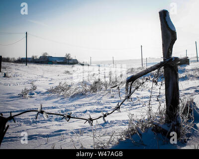 Barbed Wire Fence in the Snow Stock Photo