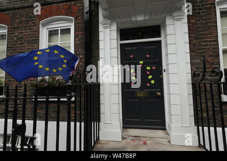 Anti-Brexit stickers and an EU flag are placed outside the campaign HQ of Boris Johnson in Westminster, London.