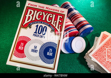 Still Life Bicycle Brand Poker Chips and Deck of Cards on a Green Felt Card Game Table, USA Stock Photo