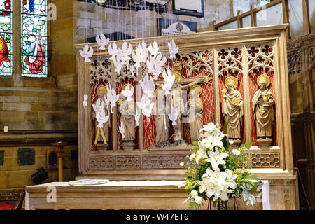 Altar with hanging white cardboard Doves in the north isle at St. Mary's Church, Scarborough, North Yorkshire, England, UK. Stock Photo