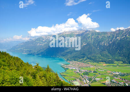 Turquoise Lake Brienz in Interlaken, Switzerland from above from Harder Kulm. Amazing Swiss landscape. Green hills, Swiss Alps. Summer Alpine landscapes. Nature. Stock Photo