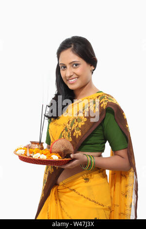 Woman holding pooja thali Stock Photo