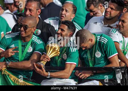 Algiers, Algeria. 20th July, 2019. Algerian national soccer team players celebrate with thousands of supporters after having clinched the 2019 Africa Cup of Nations soccer trophy in Egypt. Credit: Farouk Batiche/dpa/Alamy Live News Stock Photo