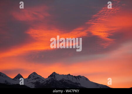 A fiery sunset over the Italian Alps Stock Photo