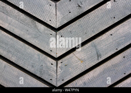 Plain grey wooden boards seen close up nailed together in a v form Stock Photo