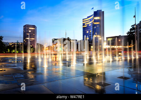 Fountains on the Place des nations with ITU and WIPO buildings in the background at night in Geneva. Switzerland Stock Photo