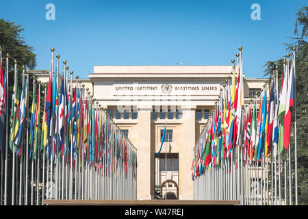 The United Nations member states flags in front of the United Nations Office in Geneva in the background. Palace of Nations, Geneva, Switzerland Stock Photo