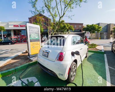 Los Angeles, JUN 15: The Fiat 500e Electric Vehicle is charging at the station on JUN 15, 2019 at Los Angeles, California Stock Photo