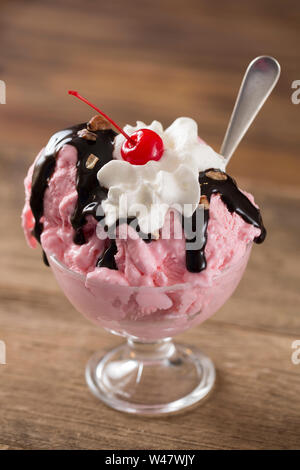 Strawberry Ice Cream Sundae on a Wood Background Stock Photo