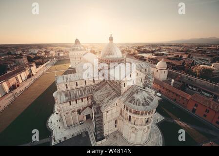 Cathedral viewed from top of Pisa leaning tower at sunset wide angle view Stock Photo