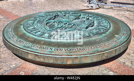 Emblem of Berlin with German Eagle on an iron plate. located near St Nicholas church in Old Town Berlin Stock Photo