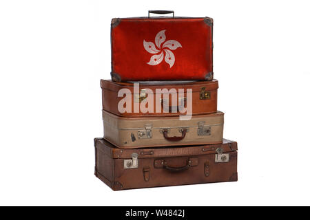 Hong Kong, China travel concept. Group of vintage suitcases isolated on white background Stock Photo