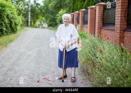 Portrait of smiling senior woman outdoors Stock Photo
