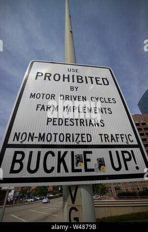 sign warning of vehicles prohibted on i-90, i-94 interstate expressway and buckle up seatbelt use Chicago IL USA
