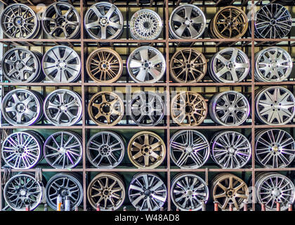 Stand with alloy wheels in tire store Stock Photo