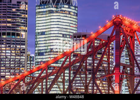 Lights turning on at blue hour over the Story Bridge Brisbane Australia Stock Photo