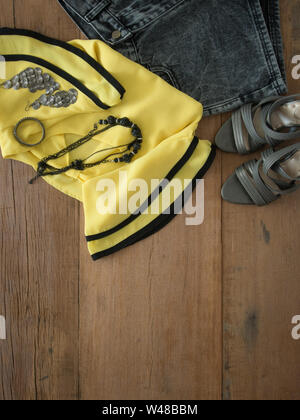 Outfit of  woman. Top view of clothing and accessory for women. Stock Photo