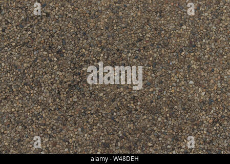 Pebble floor close up texture, brown sandwash surface Stock Photo