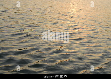Calm ripples of water on surface of a lake Stock Photo