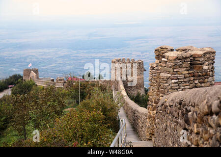 Fragment of the city wall in Signagi (Sighnaghi) against the background of the Alazani Valley, Kakheti, Georgia Stock Photo