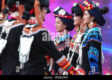 Meigu, China's Sichuan Province. 20th July, 2019. Women of Yi ethnic group pose on stage during a beauty pageant in Meigu County, southwest China's Sichuan Province, July 20, 2019. A beauty pageant of Yi ethnic group kicked off here on Saturday. A total of 28 contestants from Sichuan participated in clothing presentation and talent show during the pageant, which boasts a history of over 1,000 years. Credit: Jiang Hongjing/Xinhua/Alamy Live News Stock Photo