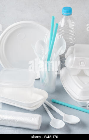 Set of white plastic disposable tableware and packaging. Various crockery. Stock Photo