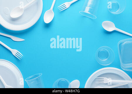 Frame background made of white plastic disposable tableware. Copy space. Stock Photo