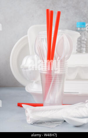 Set of white plastic disposable tableware and packaging. Various crockery. Stock Photo