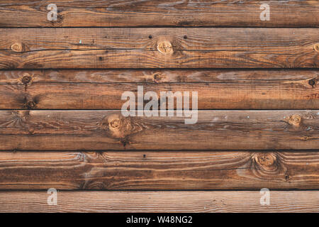 Old cracked wooden boards, brown planks. Surface of shabby weathered parquet. Woody grunge surface, rustic barn. Dirty grain timber, weathered oak. Stock Photo