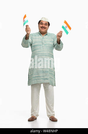 Politician standing with Indian Flags Stock Photo