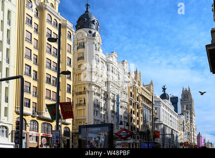 Looking along the Gran Via, in the heart of Madrid's shopping  district,  towards the Telefonica building,  from Callao metro station.  Madrid, Spain Stock Photo