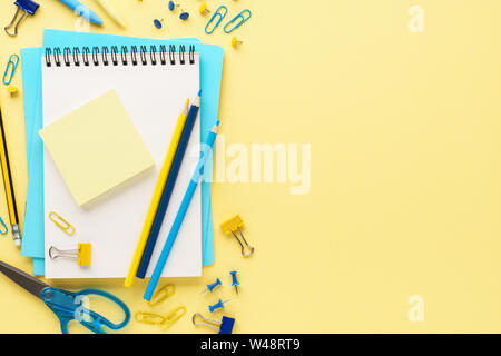 Set of various colorful school stationery and supplies on yellow background. Back to school sale concept. Stock Photo