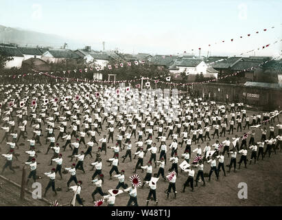 [ 1900s Japan - Japanese Elementary School Students ] —   Elementary school students participate in their school's sports day.  This image is part of 'The School Life of Young Japan' (No 19), a series published by Japanese photographer Kozaburo Tamamura in the early 1900s (late Meiji).  20th century vintage glass slide. Stock Photo