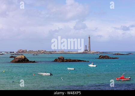 The lighthouse Ile Vierge on a sunny summer day, pier in the harbour on the north coast of Finistere, Brittany, France Stock Photo