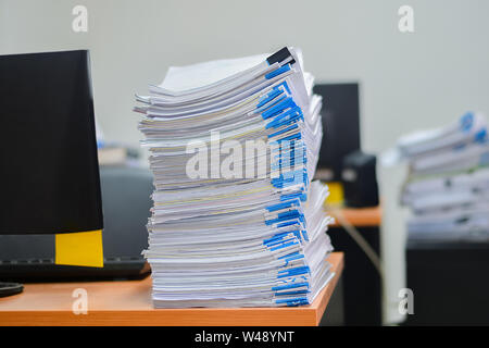 Heap of papers work stack documents on office desk ,business documents billing and examination to report the summary results annual report for Stock Photo