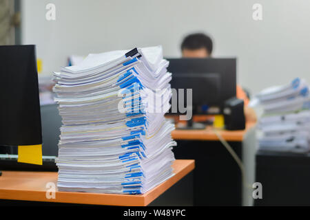 Papers work stack documents closeup on office desk ,business documents billing and examination to report the summary results annual report for Stock Photo