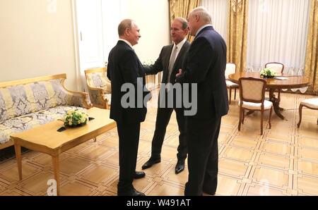 Russian President Vladimir Putin, left, and Belarus President Alexander Lukashenko, right, meet with leader of the Ukrainian Choice People’s Right party Viktor Medvedchuk July 18, 2019 in St Petersburg, Russia. The group met following the Forum of Russian and Belarusian Regions meetings. Stock Photo