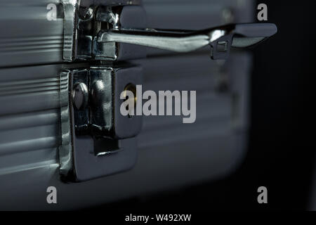 Macro of unlocked metal briefcase Stock Photo