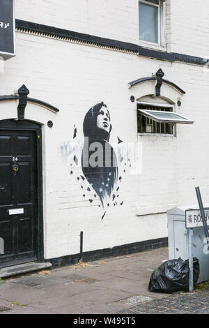 Ilhan Omar mural or graffiti art on a wall, Birmingham, Small Heath, UK Stock Photo