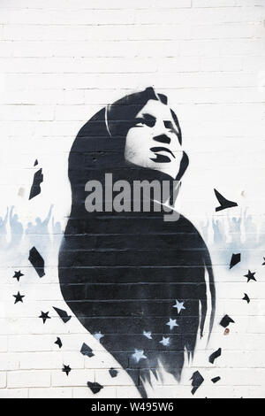 Ilhan Omar mural or graffiti art on a wall, Birmingham, Small Heath, UK Stock Photo